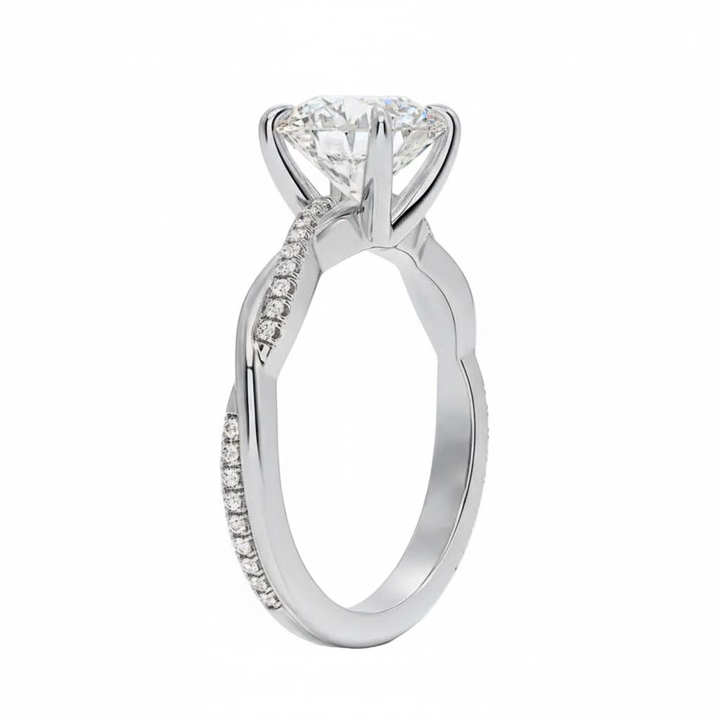Round cut Moissanite lab grown diamond engagement ring with single side pave set twisted shank on a gold band, against a white background.Moissanite engagement ring cape town south africa grand diamonds ralph jacobs jeulia 