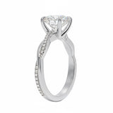 Round cut Moissanite lab grown diamond engagement ring with single side pave set twisted shank on a gold band, against a white background.Moissanite engagement ring cape town south africa grand diamonds ralph jacobs jeulia 
