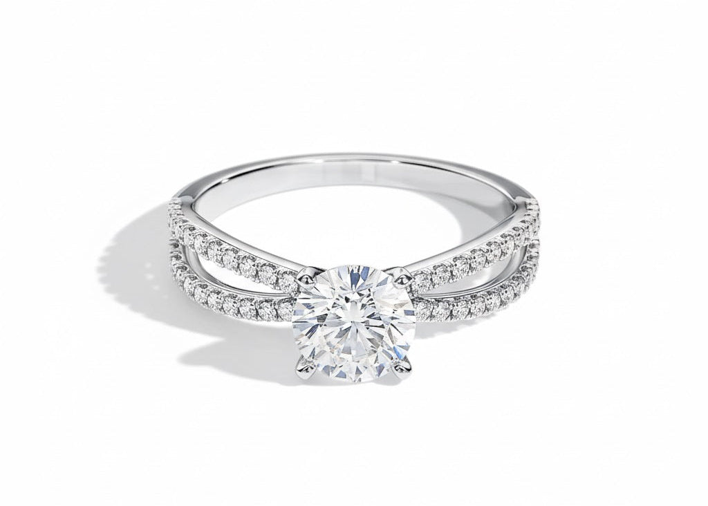 Round cut Moissanite lab grown diamond engagement ring with split pave set gold shank, against a white background.Moissanite engagement ring cape town south africa grand diamonds ralph jacobs jeulia 