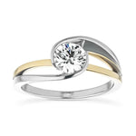 Round cut Moissanite lab grown diamond engagement ring  tension inspired wrap setting, on a two-tone gold band, against a white background.Moissanite engagement ring cape town south africa grand diamonds ralph jacobs jeulia 