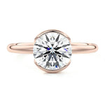 Engagement ring Round cut Moissanite lab grown diamond engagement ring  with open tube setting, on a gold band, against a white background.Moissanite engagement ring cape town south africa grand diamonds ralph jacobs jeulia 