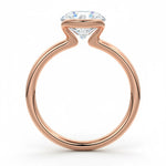 Engagement ring Round cut Moissanite lab grown diamond engagement ring  with open tube setting, on a gold band, against a white background.Moissanite engagement ring cape town south africa grand diamonds ralph jacobs jeulia 