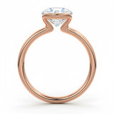 Engagement ring Round cut Moissanite lab grown diamond engagement ring  with open tube setting, on a gold band, against a white background.Moissanite engagement ring cape town south africa grand diamonds ralph jacobs jeulia 