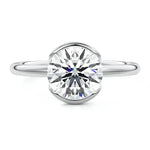 Engagement ring Round cut Moissanite lab grown diamond engagement ring  with open tube setting, on a gold band, against a white background.Moissanite engagement ring cape town south africa grand diamonds ralph jacobs jeulia 