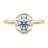 Engagement ring Round cut Moissanite lab grown diamond engagement ring  with open tube setting, on a gold band, against a white background.Moissanite engagement ring cape town south africa grand diamonds ralph jacobs jeulia 