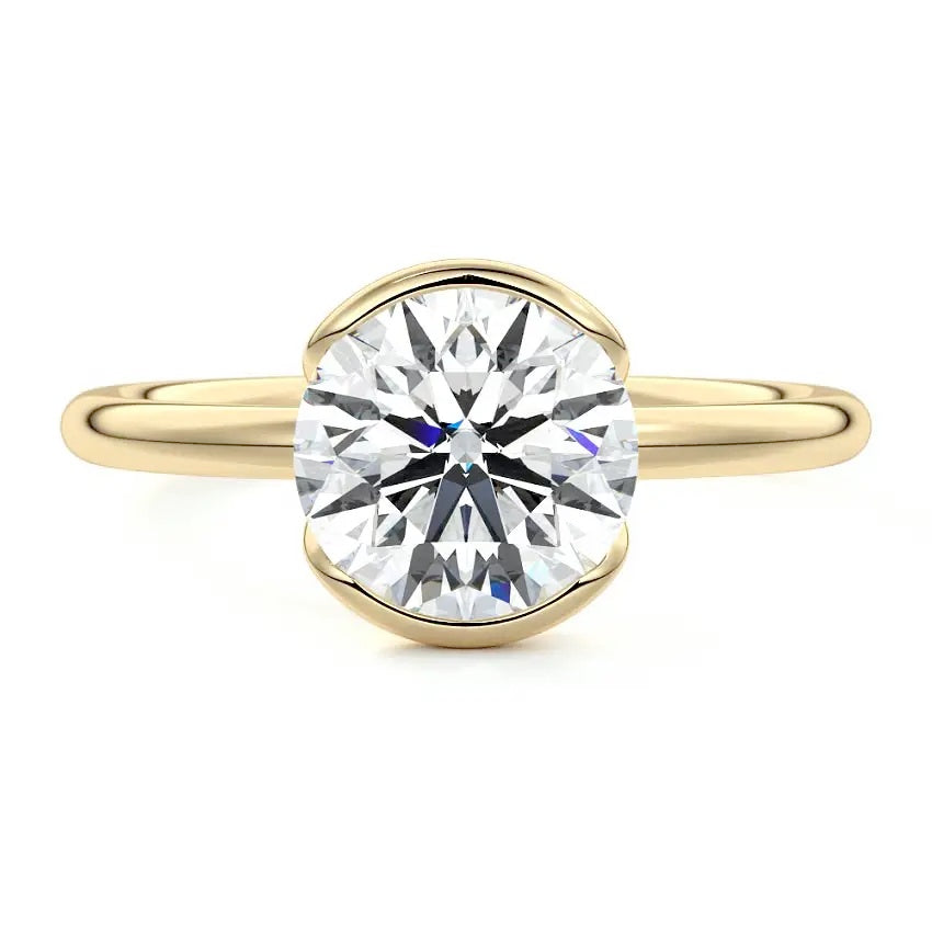 Engagement ring Round cut Moissanite lab grown diamond engagement ring  with open tube setting, on a gold band, against a white background.Moissanite engagement ring cape town south africa grand diamonds ralph jacobs jeulia 