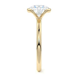 Engagement ring Round cut Moissanite lab grown diamond engagement ring  with open tube setting, on a gold band, against a white background.Moissanite engagement ring cape town south africa grand diamonds ralph jacobs jeulia 