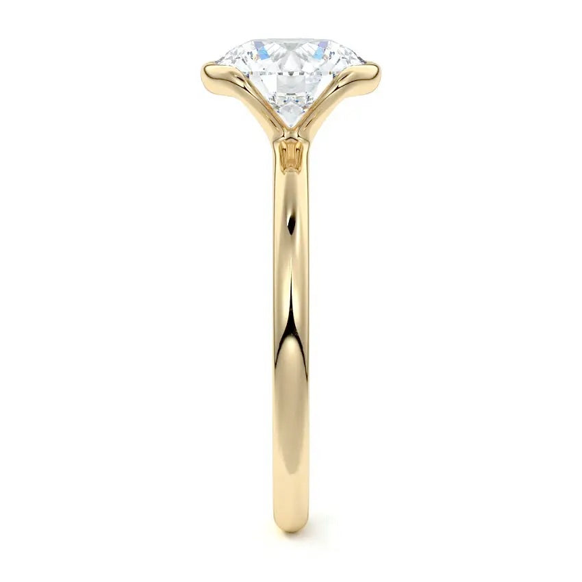 Engagement ring Round cut Moissanite lab grown diamond engagement ring  with open tube setting, on a gold band, against a white background.Moissanite engagement ring cape town south africa grand diamonds ralph jacobs jeulia 