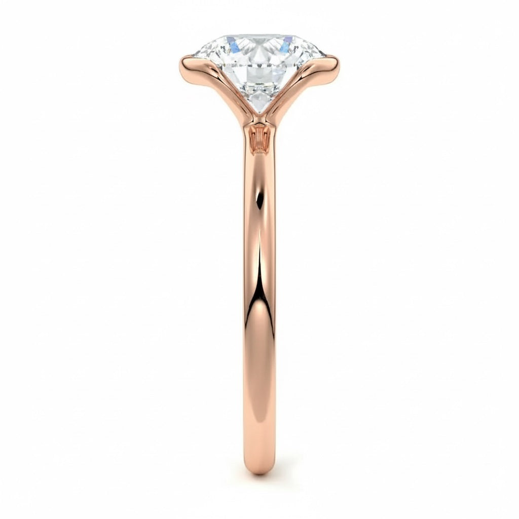 Engagement ring Round cut Moissanite lab grown diamond engagement ring  with open tube setting, on a gold band, against a white background.Moissanite engagement ring cape town south africa grand diamonds ralph jacobs jeulia 