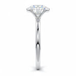 Engagement ring Round cut Moissanite lab grown diamond engagement ring  with open tube setting, on a gold band, against a white background.Moissanite engagement ring cape town south africa grand diamonds ralph jacobs jeulia 