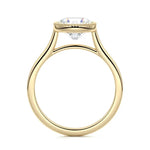Round cut Moissanite lab grown diamond engagement ring round shank with a bezel setting, on a gold band, against a white background.Moissanite engagement ring cape town south africa grand diamonds ralph jacobs jeulia 
