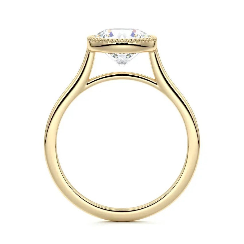 Round cut Moissanite lab grown diamond engagement ring round shank with a bezel setting, on a gold band, against a white background.Moissanite engagement ring cape town south africa grand diamonds ralph jacobs jeulia 