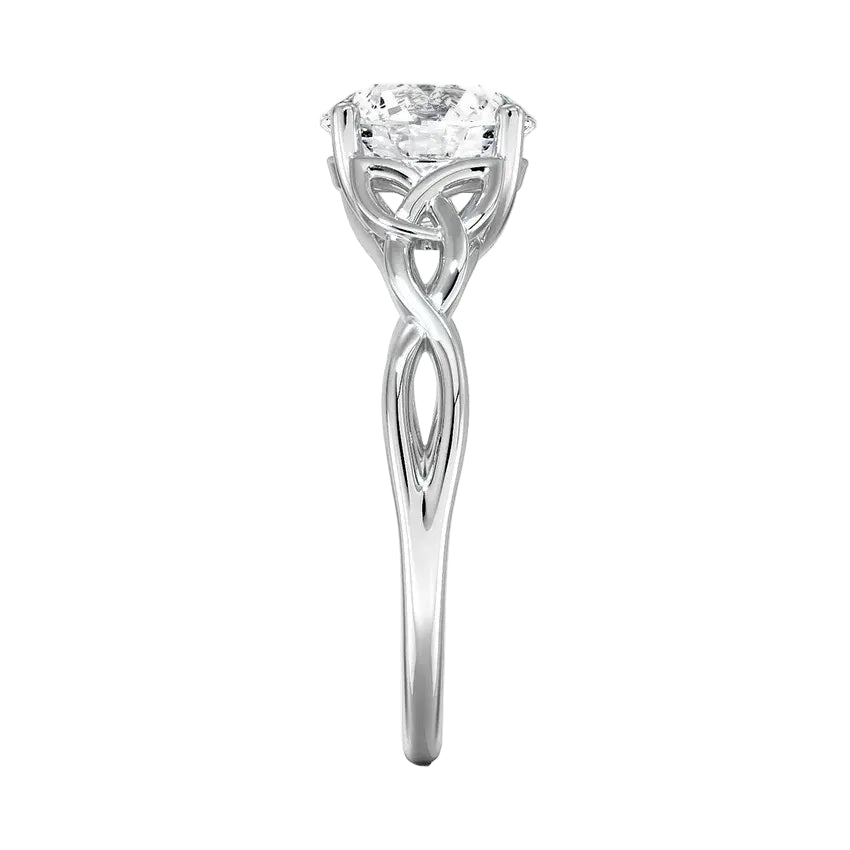 Round cut Moissanite lab grown diamond engagement ring infinity shank with a ornate setting, and intricate basket design on a gold band, against a white background.Moissanite engagement ring cape town south africa grand diamonds ralph jacobs jeuli