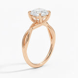 Round cut Moissanite lab grown diamond engagement ring twisted  band with a four claw setting, on a gold band, against a white background.Moissanite engagement ring cape town south africa grand diamonds ralph jacobs jeulia  