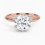 Round cut Moissanite lab grown diamond engagement ring round shank with a six claw setting, on a gold band, against a white background.Moissanite engagement ring cape town south africa grand diamonds ralph jacobs jeuli