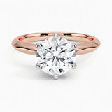 Round cut Moissanite lab grown diamond engagement ring round shank with a six claw setting, on a gold band, against a white background.Moissanite engagement ring cape town south africa grand diamonds ralph jacobs jeuli