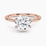 Round cut Moissanite lab grown diamond engagement ring round band with a six claw setting, on a gold band, against a white background.Moissanite engagement ring cape town south africa grand diamonds ralph jacobs jeulia  