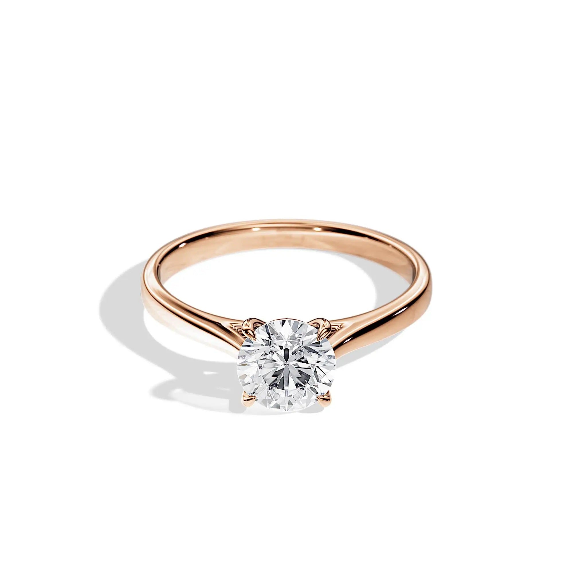 Engagement ring Cathedral setting round cut Moissanite lab grown diamond engagement ring round shank with a four claw setting, on a gold band, against a white background.Moissanite engagement ring cape town south africa grand diamonds ralph jacobs jeulia 