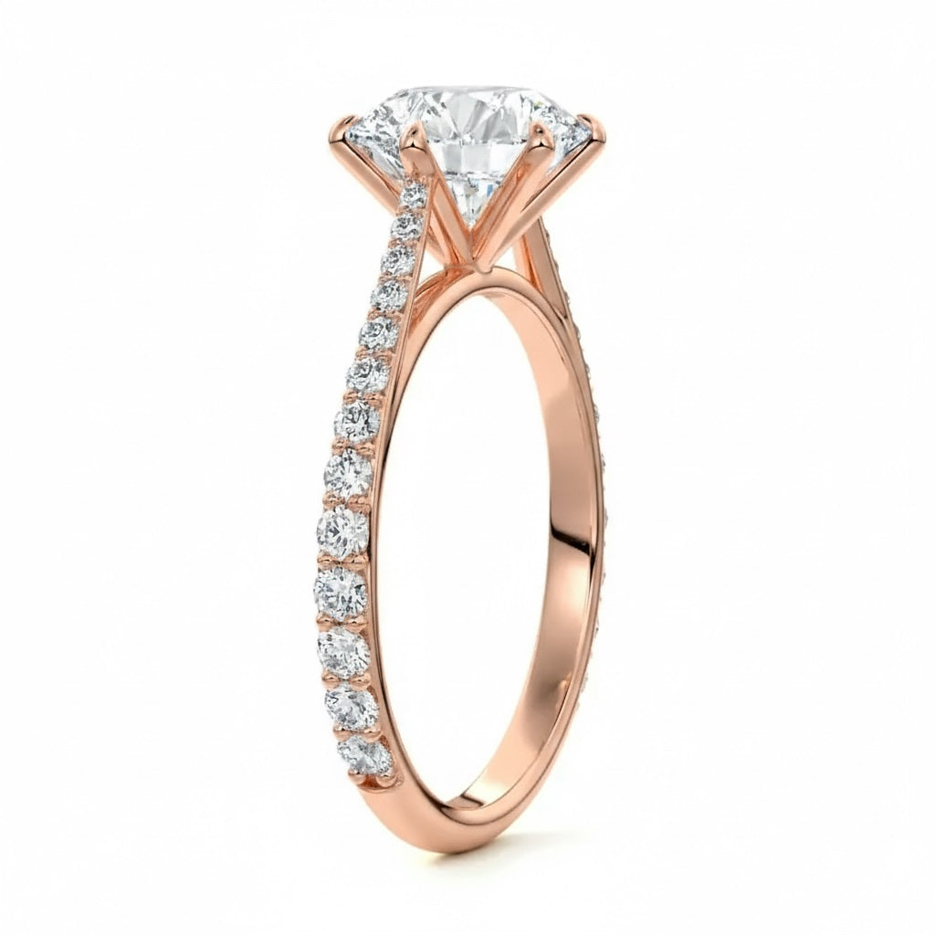 Round cut Moissanite lab grown diamond engagement ring with cathedral  set main stone and tapered pave set shank on a gold band, against a white background.Moissanite engagement ring cape town south africa grand diamonds ralph jacobs jeulia 