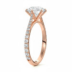 Round cut Moissanite lab grown diamond engagement ring with cathedral  set main stone and tapered pave set shank on a gold band, against a white background.Moissanite engagement ring cape town south africa grand diamonds ralph jacobs jeulia 