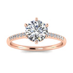 Round cut Moissanite lab grown diamond engagement ring with pave set shank with six  prong setting, on a gold band, against a white background.Moissanite engagement ring cape town south africa grand diamonds ralph jacobs jeulia 