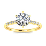 Round cut Moissanite lab grown diamond engagement ring with pave set shank with six  prong setting, on a gold band, against a white background.Moissanite engagement ring cape town south africa grand diamonds ralph jacobs jeulia 
