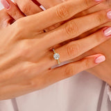 Round cut Moissanite lab grown diamond engagement ring with fancy set pave gold band, against a white background.Moissanite engagement ring cape town south africa grand diamonds ralph jacobs jeulia 