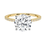 Round cut Moissanite lab grown diamond engagement ring with two tone design, yellow and white gold, pave set band, against a white background.Moissanite engagement ring cape town south africa grand diamonds ralph jacobs jeulia 
