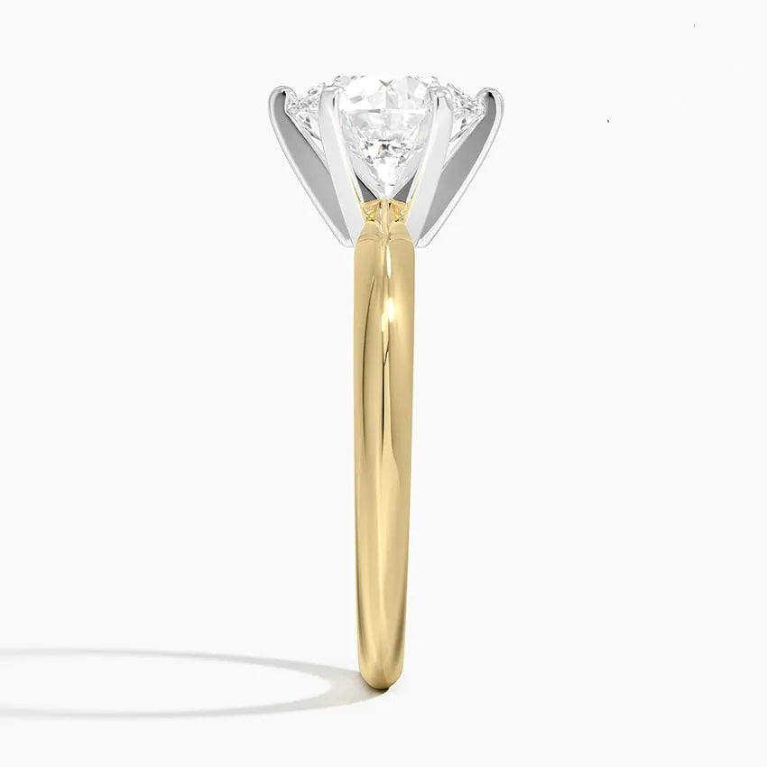 Round cut Moissanite lab grown diamond engagement ring round shank with a six claw setting, on a gold band, against a white background.Moissanite engagement ring cape town south africa grand diamonds ralph jacobs jeuli