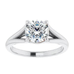 Engagement ring Cathedral setting round cut Moissanite lab grown diamond engagement ring v-Split round shank with a four claw setting, on a gold band, against a white background.Moissanite engagement ring cape town south africa grand diamonds ralph jacobs jeulia 