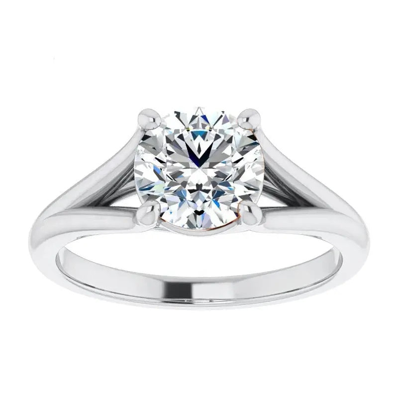 Engagement ring Cathedral setting round cut Moissanite lab grown diamond engagement ring v-Split round shank with a four claw setting, on a gold band, against a white background.Moissanite engagement ring cape town south africa grand diamonds ralph jacobs jeulia 