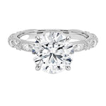 Round cut Moissanite lab grown diamond engagement ring with classic set centre stone and vintage set stones on the band, against a white background.Moissanite engagement ring cape town south africa grand diamonds ralph jacobs jeulia 