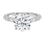 Round cut Moissanite lab grown diamond engagement ring with classic set centre stone and vintage set stones on the band, against a white background.Moissanite engagement ring cape town south africa grand diamonds ralph jacobs jeulia 