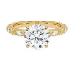 Round cut Moissanite lab grown diamond engagement ring with classic set centre stone and vintage set stones on the band, against a white background.Moissanite engagement ring cape town south africa grand diamonds ralph jacobs jeulia 