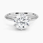 Round cut Moissanite lab grown diamond engagement ring round shank with a six claw setting, on a gold band, against a white background.Moissanite engagement ring cape town south africa grand diamonds ralph jacobs jeuli