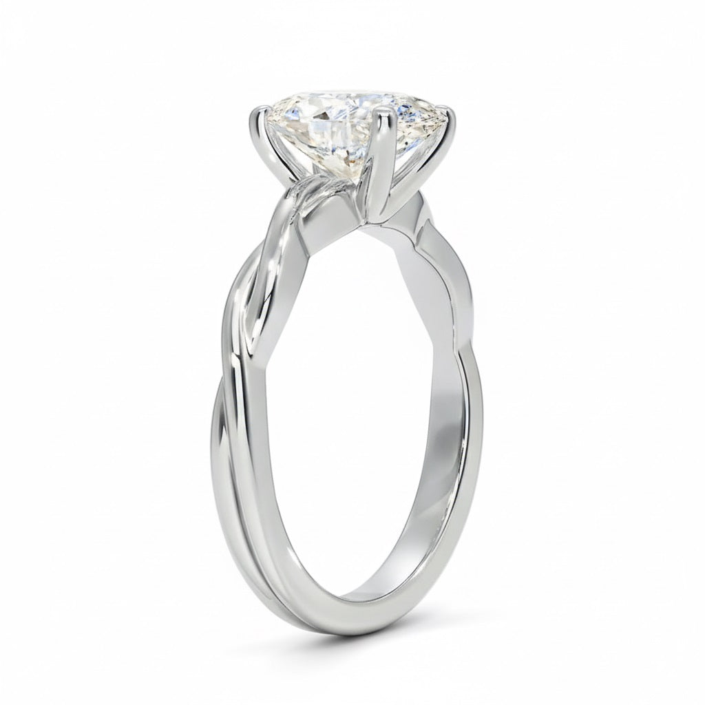 Oval cut Moissanite lab grown diamond engagement ring braided shank with a four claw setting, on a gold band, against a white background.Moissanite engagement ring cape town south africa grand diamonds ralph jacobs jeulia 