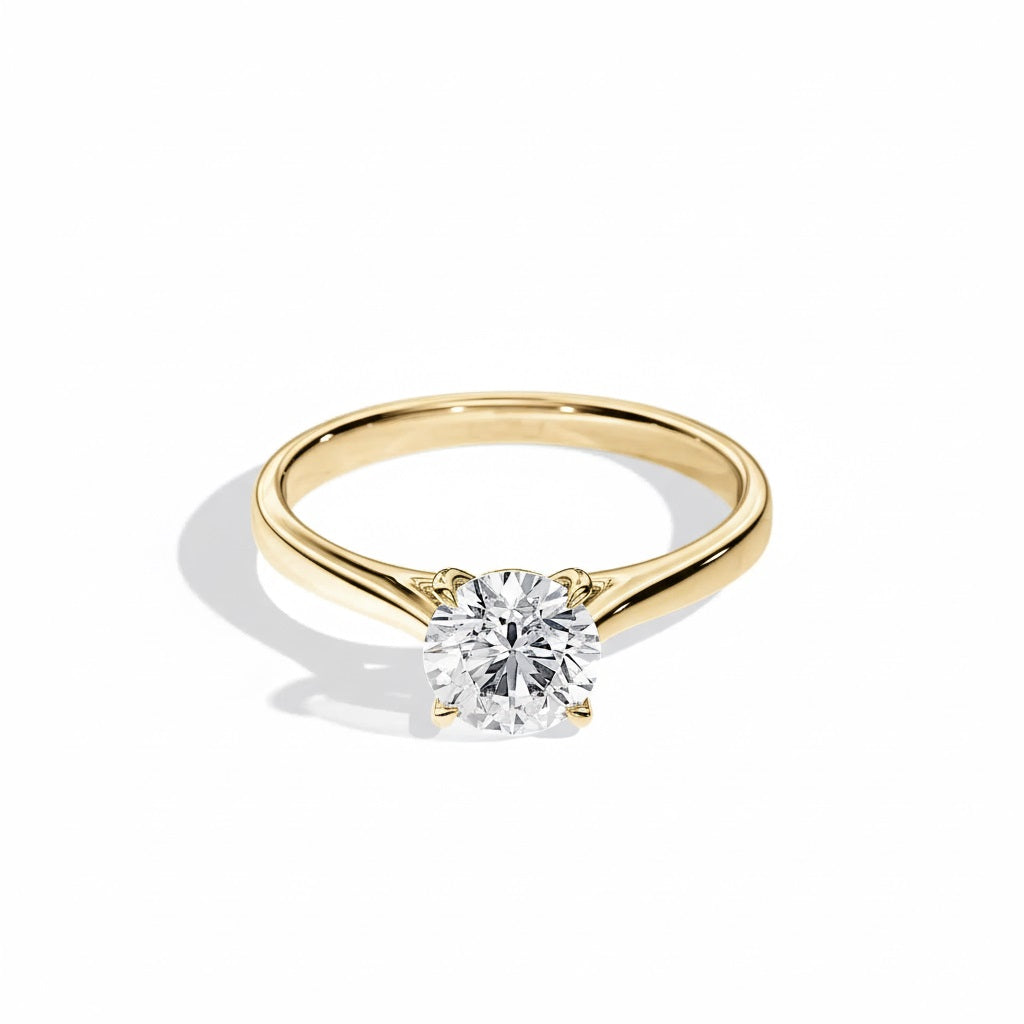 Engagement ring Cathedral setting round cut Moissanite lab grown diamond engagement ring round shank with a four claw setting, on a gold band, against a white background.Moissanite engagement ring cape town south africa grand diamonds ralph jacobs jeulia 