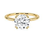 Engagement ring round cut Moissanite lab grown diamond round shank with a four cat double claw setting, on a gold band, against a white background.Moissanite engagement ring cape town south africa grand diamonds ralph jacobs jeulia 