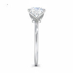 Engagement ring round cut Moissanite lab grown diamond round shank with a four cat double claw setting, on a gold band, against a white background.Moissanite engagement ring cape town south africa grand diamonds ralph jacobs jeulia 