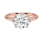 Engagement ring Round cut Moissanite lab grown diamond engagement ring v-Split round shank with a four cat-claw setting, on a gold band, against a white background.Moissanite engagement ring cape town south africa grand diamonds ralph jacobs jeulia 