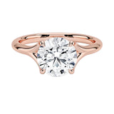 Engagement ring Round cut Moissanite lab grown diamond engagement ring v-Split round shank with a four cat-claw setting, on a gold band, against a white background.Moissanite engagement ring cape town south africa grand diamonds ralph jacobs jeulia 