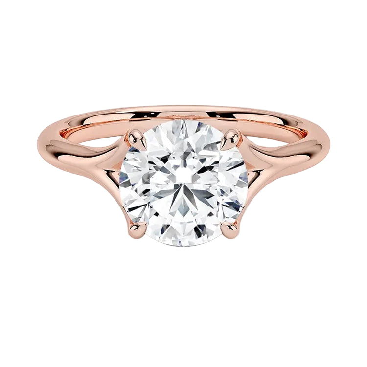 Engagement ring Round cut Moissanite lab grown diamond engagement ring v-Split round shank with a four cat-claw setting, on a gold band, against a white background.Moissanite engagement ring cape town south africa grand diamonds ralph jacobs jeulia 