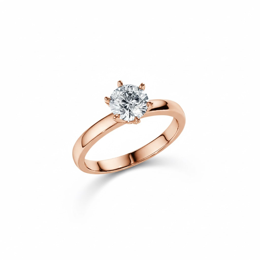 Round cut Moissanite lab grown diamond engagement ring round band with a six claw setting, on a gold band, against a white background.Moissanite engagement ring cape town south africa grand diamonds ralph jacobs jeulia  