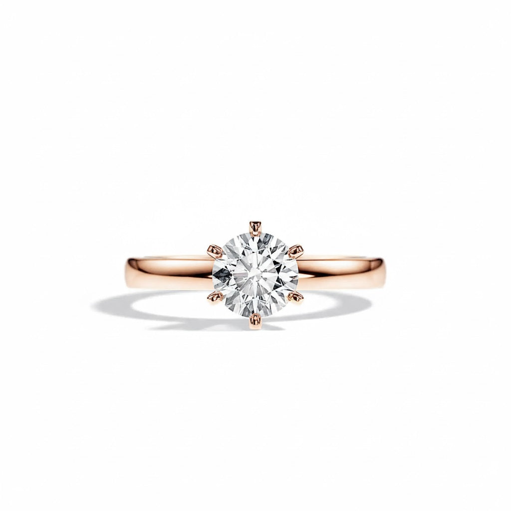 Round cut Moissanite lab grown diamond engagement ring round band with a six claw setting, on a gold band, against a white background.Moissanite engagement ring cape town south africa grand diamonds ralph jacobs jeulia  