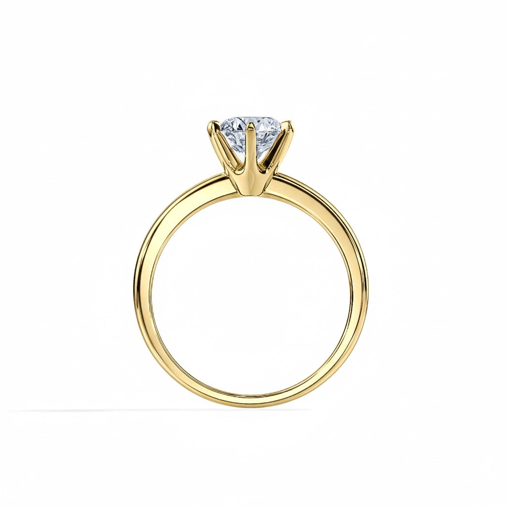 Round cut Moissanite lab grown diamond engagement ring round band with a six claw setting, on a gold band, against a white background.Moissanite engagement ring cape town south africa grand diamonds ralph jacobs jeulia  
