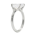 Engagement ring Round cut Moissanite lab grown diamond engagement ring v-Split round shank with a four cat-claw setting, on a gold band, against a white background.Moissanite engagement ring cape town south africa grand diamonds ralph jacobs jeulia 