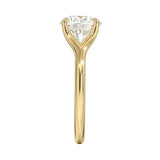 Engagement ring Round cut Moissanite lab grown diamond engagement ring v-Split round shank with a four cat-claw setting, on a gold band, against a white background.Moissanite engagement ring cape town south africa grand diamonds ralph jacobs jeulia 