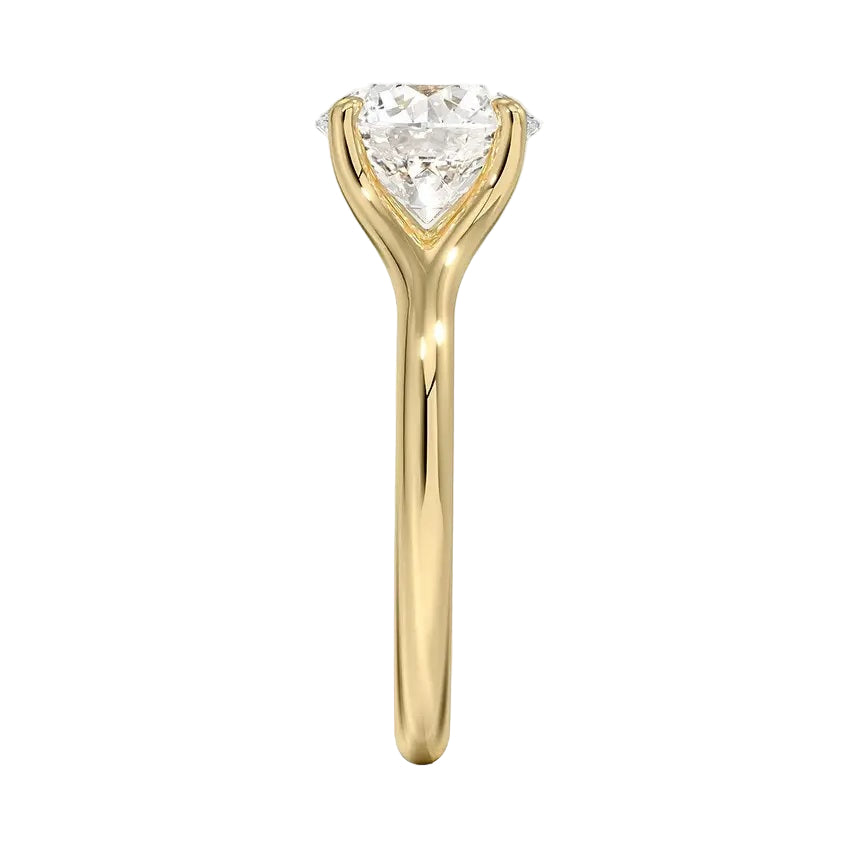 Engagement ring Round cut Moissanite lab grown diamond engagement ring v-Split round shank with a four cat-claw setting, on a gold band, against a white background.Moissanite engagement ring cape town south africa grand diamonds ralph jacobs jeulia 