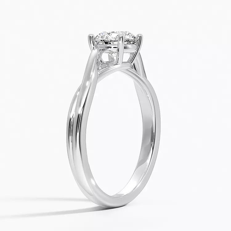 Round cut Split Shank Moissanite lab grown diamond engagement ring round shank with a six claw setting, on a gold band, against a white background.Moissanite engagement ring cape town south africa grand diamonds ralph jacobs jeuli