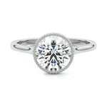 Round cut Moissanite lab grown diamond engagement ring round shank with a bezel setting, on a gold band, against a white background.Moissanite engagement ring cape town south africa grand diamonds ralph jacobs jeulia 